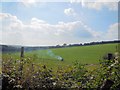 TQ3410 : Crop spraying St Mary's Farm by Paul Gillett