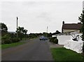 Car turning from the Tullymacreeve Road, Mullaghbawn, on to the Back Road