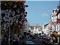 Lyme Regis: bunting and flowers in Broad Street