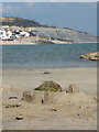 SY3391 : Lyme Regis: a sandcastle and view back to town by Chris Downer