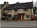 Cottages and postbox opposite the Butter Cross in Castle Combe