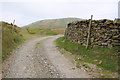 SD7198 : Dry stone wall beside track, Murthwaite Rigg by Roger Templeman