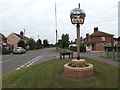 TM2784 : High Road & Wortwell Village sign by Geographer
