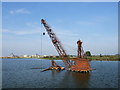 TQ7174 : Crane rusting in a flooded gravel pit, near Cliffe by Chris Whippet