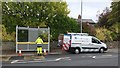 Cleaning the bus shelter on Rainford Road, Billinge