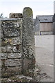 Benchmark on gatepost at entrance to Mile House Farm