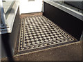 SX9472 : Tiled floor to shop entrance, George Street, Teignmouth by Robin Stott