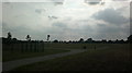 View of the A13 and the wind turbine at Beckton from Goresbrook Sports Ground