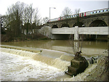 SP3065 : The River Leam engulfs the weir at Edmondscote, Leamington by Robin Stott