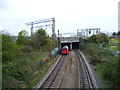 TQ1884 : A Bakerloo line train passes under the West Coast Main Line by Marathon