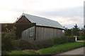 Wooden barn by bungalow in Mill Lane, Brant Broughton