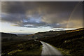 Minor road down to Farr on a dramatic afternoon for weather