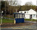 Milestone and bus shelter in Coytrahen