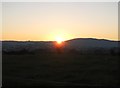 Sun sinking at the col between Cashel and Mullaghbane Mountain