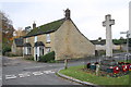 SP3917 : Houses and war memorial beside Combe Road by Roger Templeman