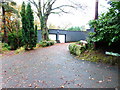 Garages by footpath near Little Ribsden