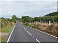 View east along the Bann Road in the col between Slievebeg and Ballymagreehan Hill