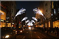 TQ2881 : View of peacock feather Christmas decorations on New Bond Street #4 by Robert Lamb