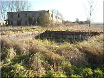 SU0571 : Accommodation block and water tank, former RAF Yatesbury air base by Vieve Forward