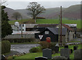 Llandegley - churchyard, road, farm and hill