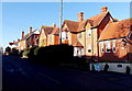 Sunlit houses and deep shadows on Wyke Road, Gillingham