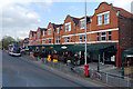 A row of bars and restaurants on Barlow Moor Road