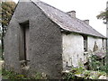 Side entrance from Ballinasack Road to a derelict house