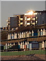 Southbourne: beach huts and a reflected sun