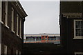 View of a train pulling into Hoxton station from the grounds of the Geffrye Museum