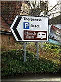 TM4557 : Roadsign on Church Farm Road by Geographer