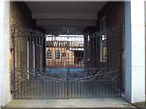 SP1284 : Wrought iron gates to funeral directors’ yard, near Swan Island, South Yardley by Robin Stott
