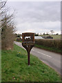 TM3297 : Mundham village sign outside the church gate by Adrian S Pye