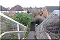 Looking east down steps from railway footbridge