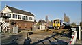 Northern Rail train leaves East Brough level crossing