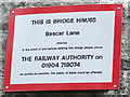 Sign on railway bridge HIM/65