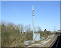 Communications mast beside railway