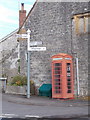 ST3706 : Winsham: telephone box and signpost by Chris Downer