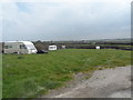 Field with scattered semi-derelict caravans