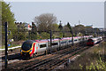 Northbound "Pendolino" and Underground trains at Conway Gardens