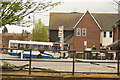 View of a myriad of bus stops on Bircherley Street from the Lea towpath