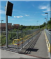 Down a ramp towards platform 1 at Llanharan railway station