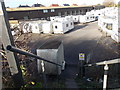 Steps down to a public footpath through the Highbridge Caravan Centre yard