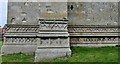 Cawston: St Agnes Church: Interesting carvings at the base of the tower