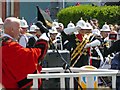 The Mayor of N.E. Lincolnshire Coun. Alex Baxter dofs his hat to the parade