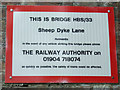 Sign on railway bridge No. HBS/33