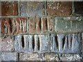 NY5922 : Grooves, porch of St Lawrence's Church, Morland by Karl and Ali