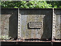 Plaque on bridge over disused railway line