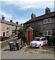 Pink Mini and cottages at Buxworth