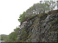 NM8322 : Rock cut on the  A816 by M J Richardson