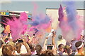 View of a fourth mass colour throw in front of the stage at the Colour Run